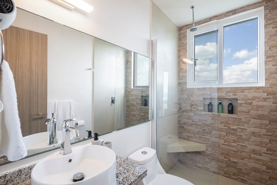 Deluxe Studio Suite, 1 King Bed with Sofa bed, Balcony, Ocean View | Bathroom | Shower, rainfall showerhead, eco-friendly toiletries, hair dryer
