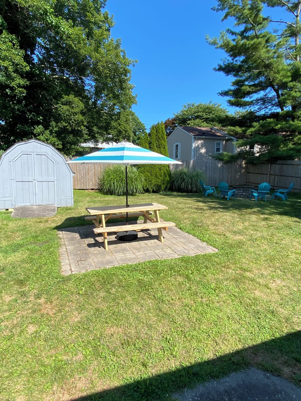 Fully fenced in backyard - picnic table, grill, firepit, yard games