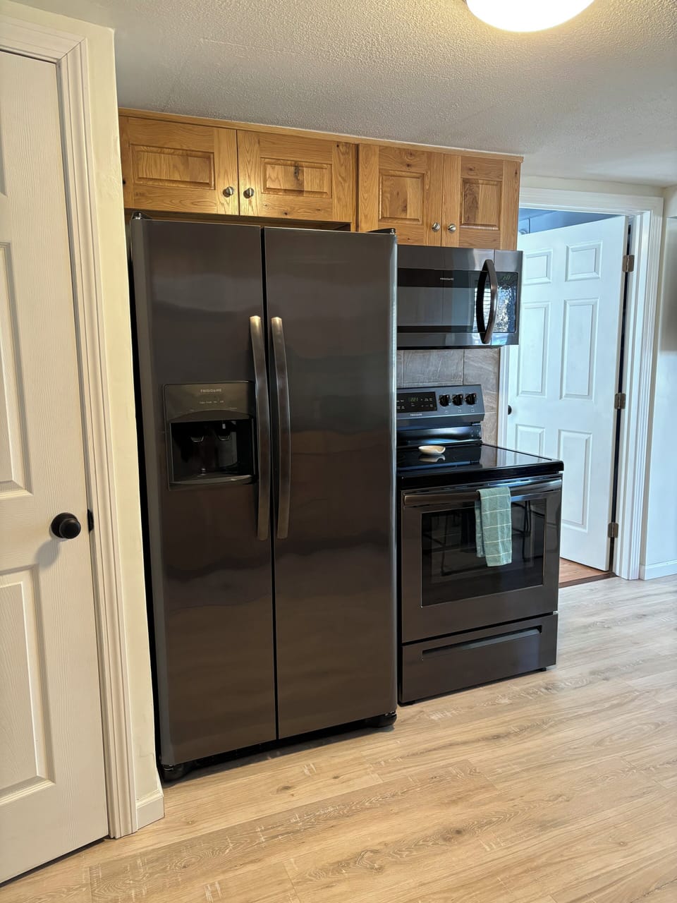 Closet with laundry in kitchen