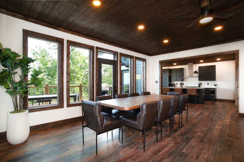 With direct access to the outdoor deck, this dining space transitions effortlessly from cozy meals indoors to breezy alfresco dining.