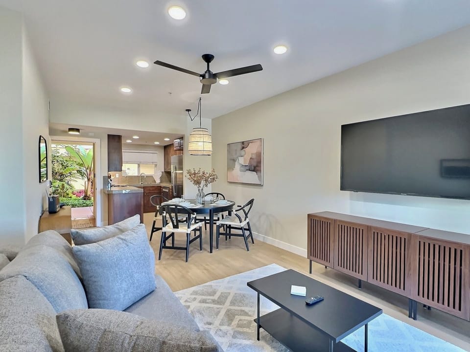 The open living space features a dining area for 4 guests, a comfortable queen sleeper sofa, and a SmartTV for your entertainment.