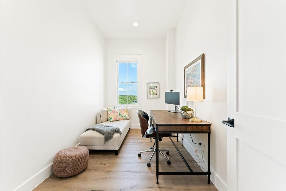 2nd Floor: Private office with monitor and chaise, blackout shade