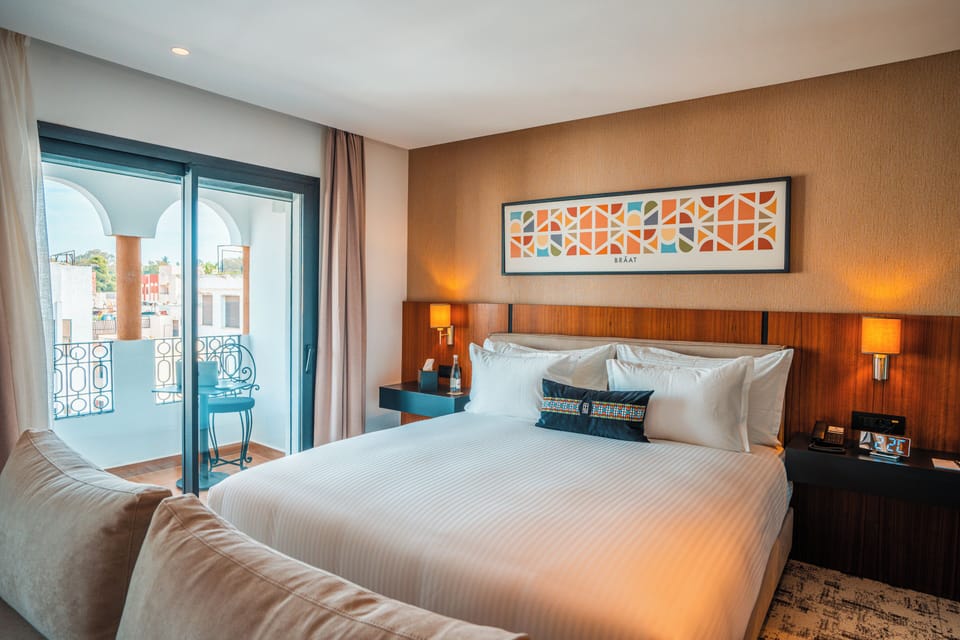 Suite, Balcony, City View | Hypo-allergenic bedding, free minibar, in-room safe, desk