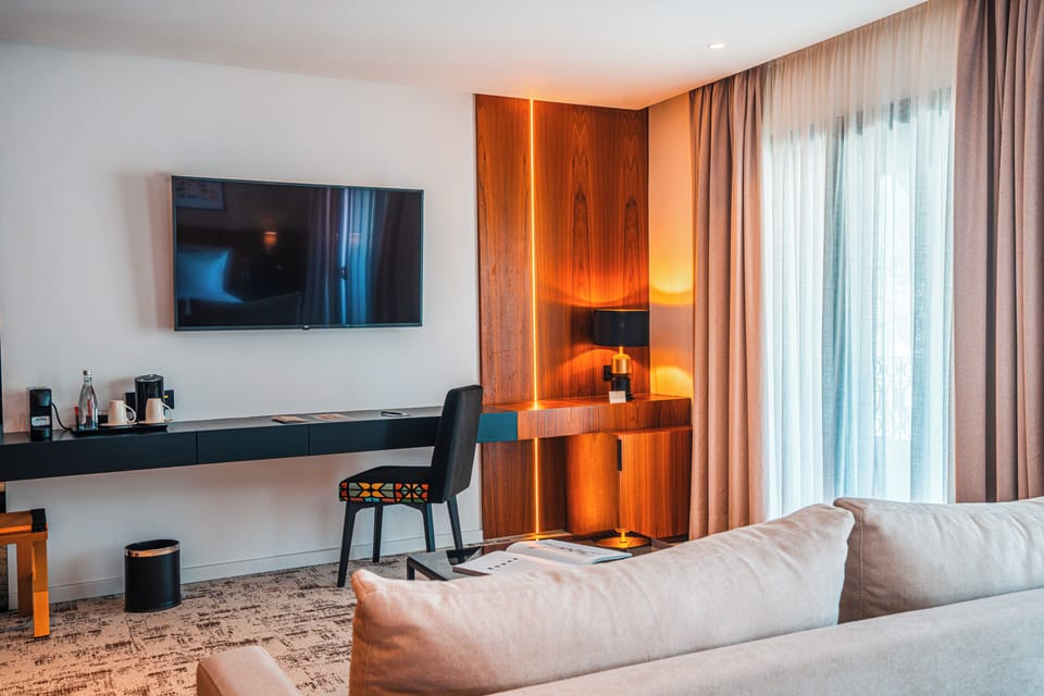 Suite, Balcony, City View | Hypo-allergenic bedding, free minibar, in-room safe, desk