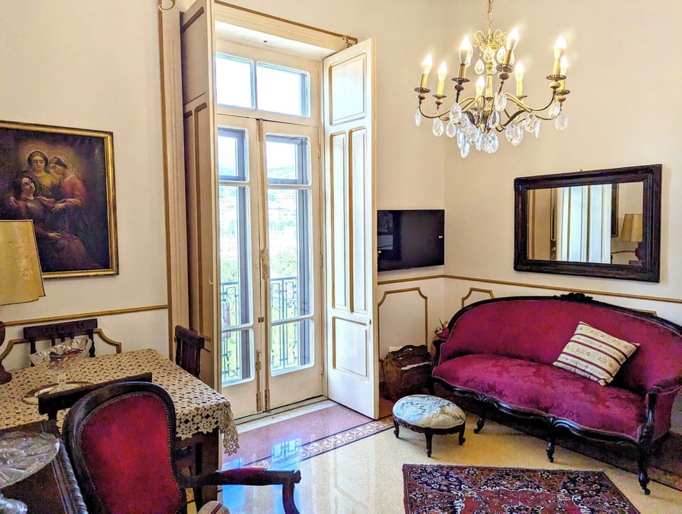 Deluxe Suite, City View | Living area | TV