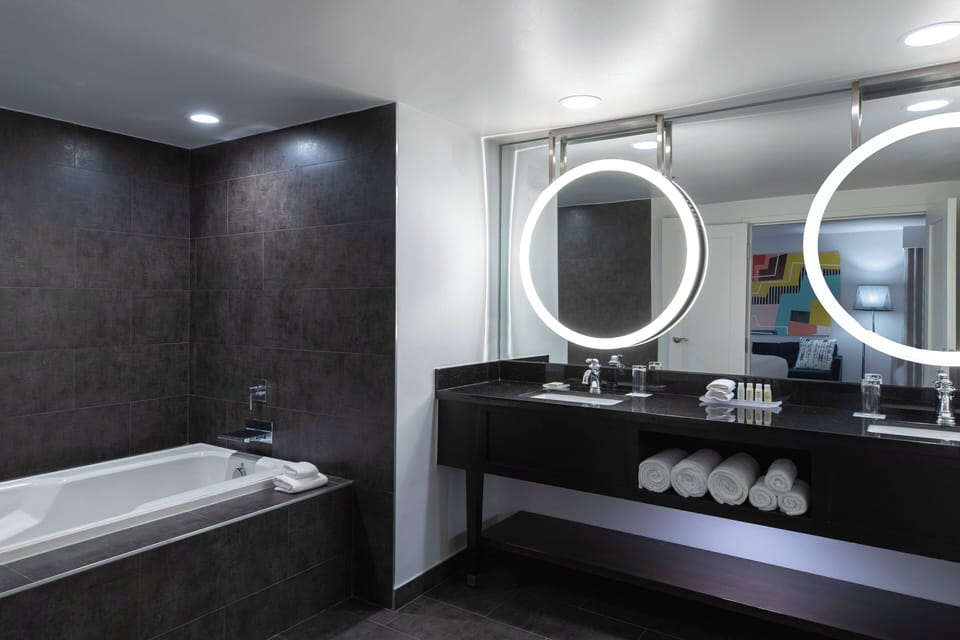 Designer toiletries, hair dryer, towels