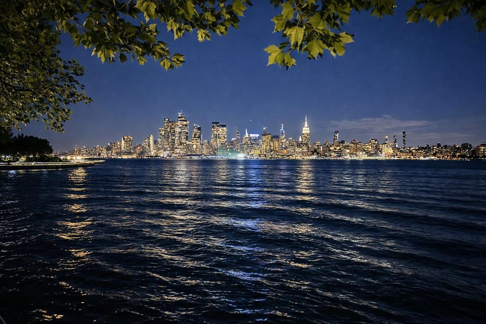 Waterfront skyline views at dusk—sparkling city lights, serene vibes.