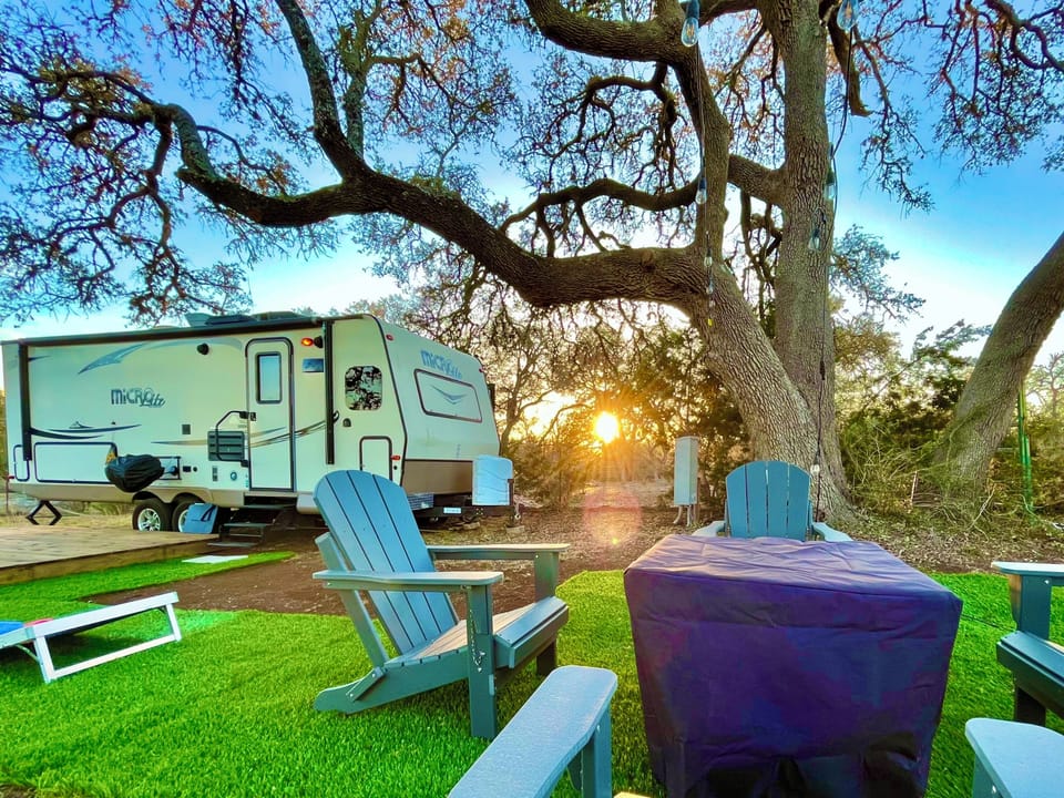 The Ramblin' Rose Camper and the common area Fire Table.