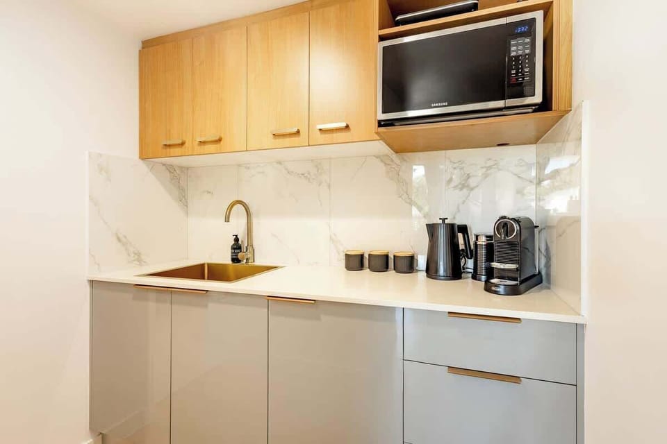 Prepare light meals and easy breakfasts in the neatly appointed kitchenette, complete with a microwave, coffee machine, and induction cooktop for relaxed mornings indoors.