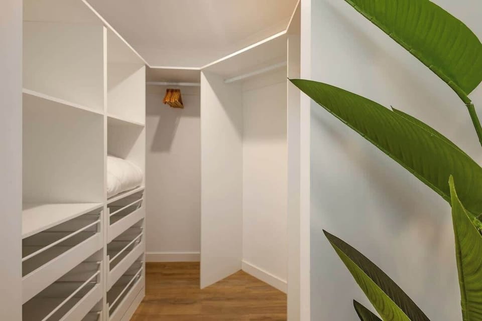 The spacious walk-in wardrobe provides ample room to unpack and settle in, helping longer stays feel effortlessly organised and comfortable.