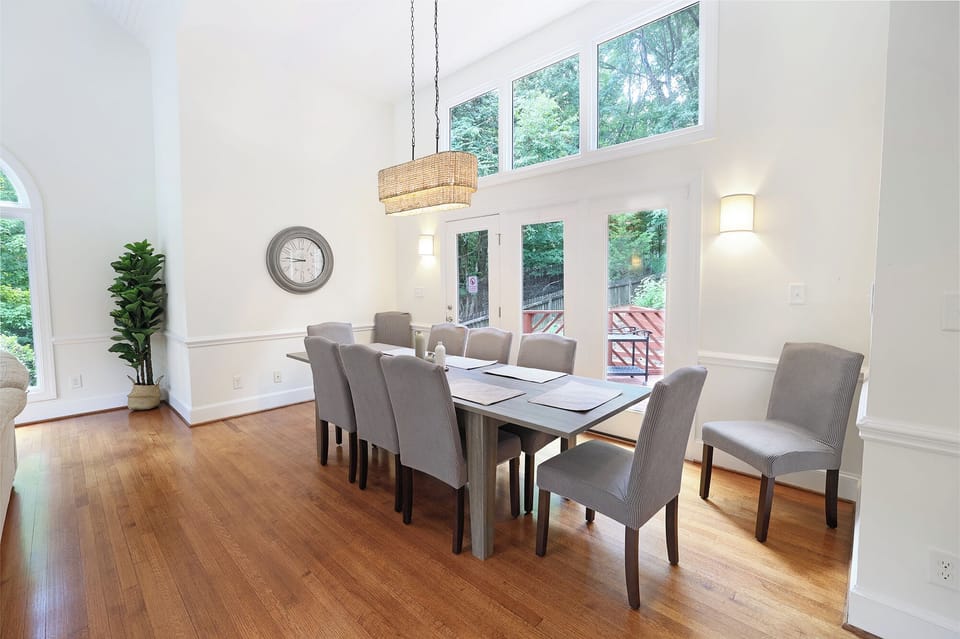 Dining area with large table and 10 dining chairs