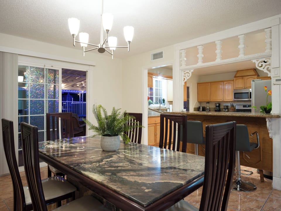 Enjoy a meal together at the table, bar, or cocktail table.