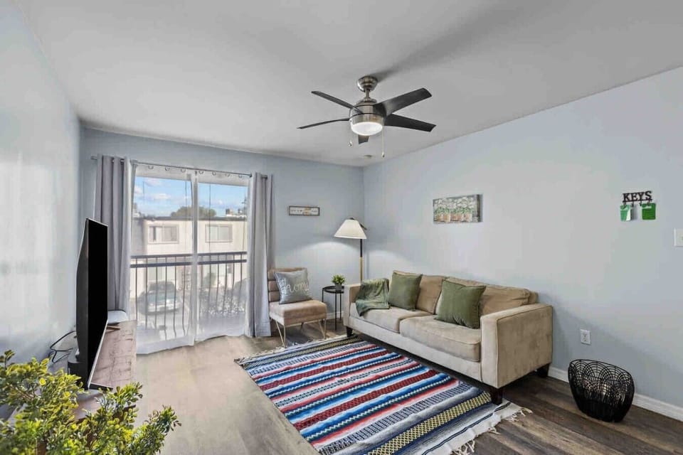Living room with SMART, books, Board games, House Manual, and Portable inflatable bed.