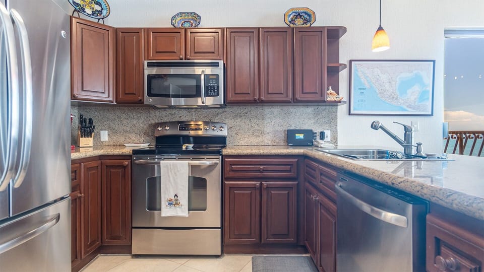 Complete care appliances, granite counter, and lots of cabinetry in the kitchen.