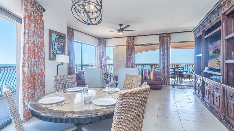 The main room has plenty of space, a large entertainment center, living room and dining table.