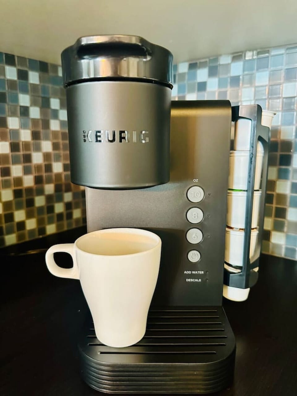 Keurig machine with complimentary k-cups of coffee and tea..