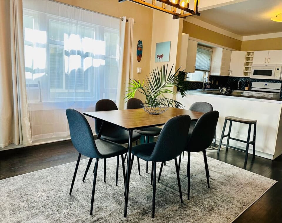 Dining area with seating for 6 at the table and 2 counter stools.