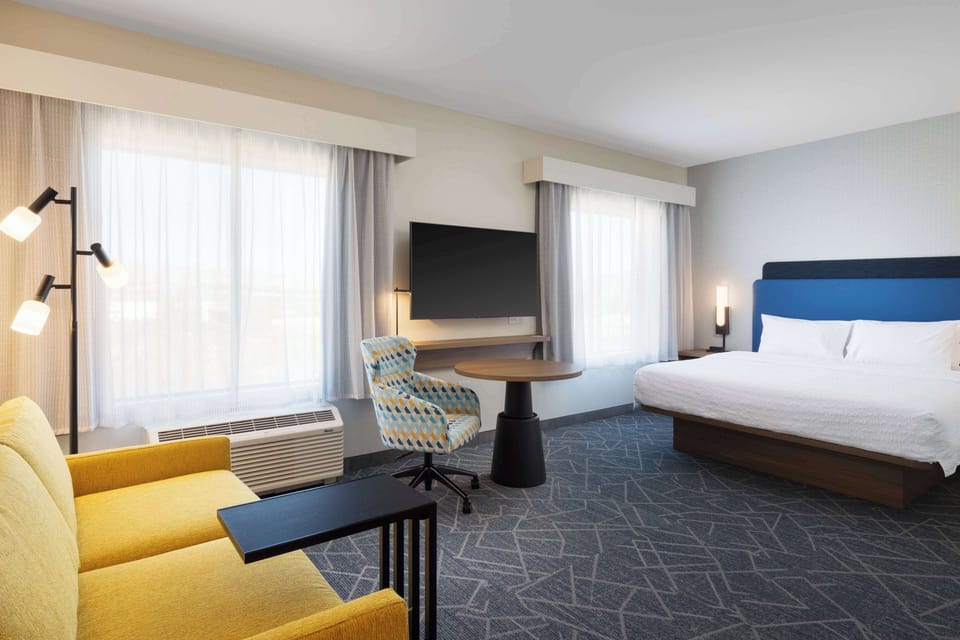 Studio Suite, 1 King Bed | Living area | 50-inch TV with cable channels