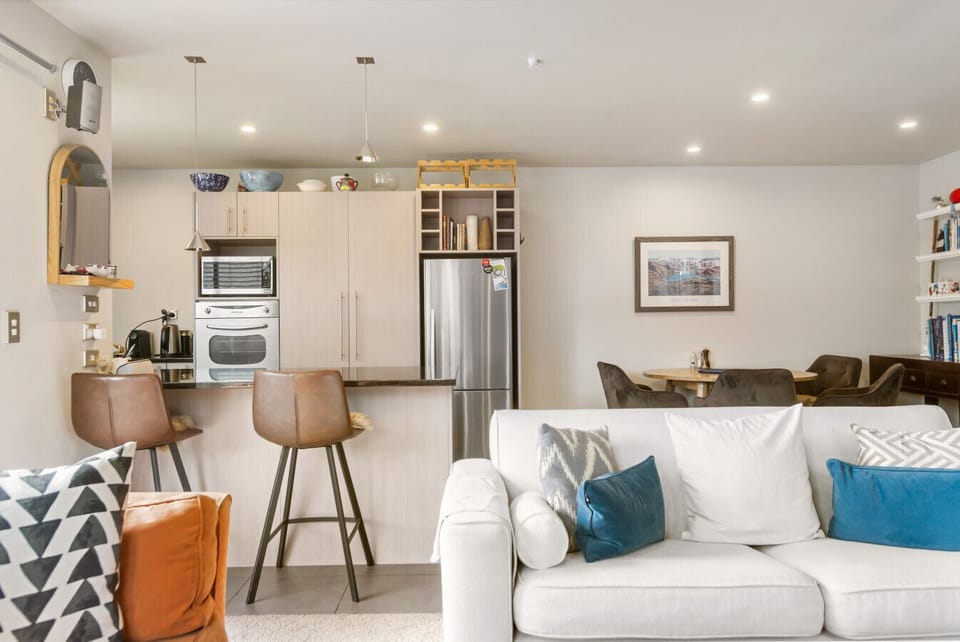 From the living area, looking towards the dining and kitchen area
