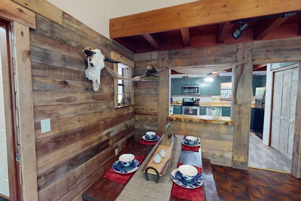 Rock Haven – Unique dining nook with rustic wood walls and lodge-style seating.