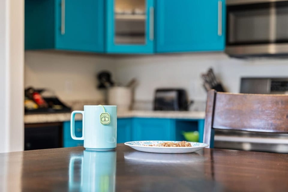 The dining table is located in the kitchen area for convenient access an easy setup.