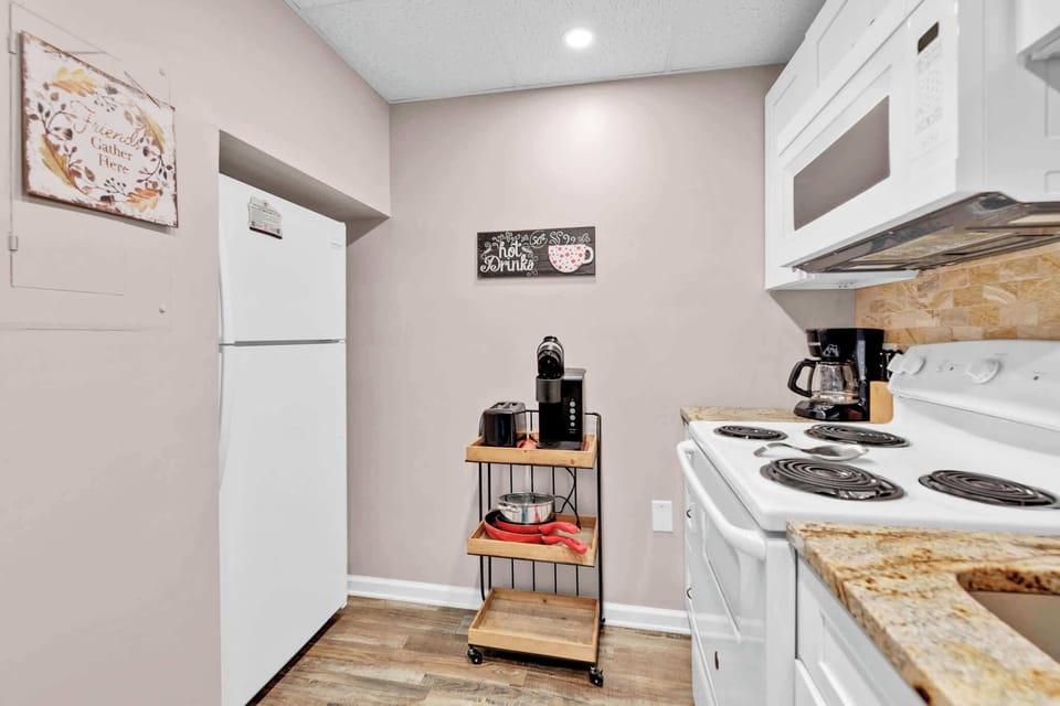 The open, airy kitchen offers ample space & all the comforts of home