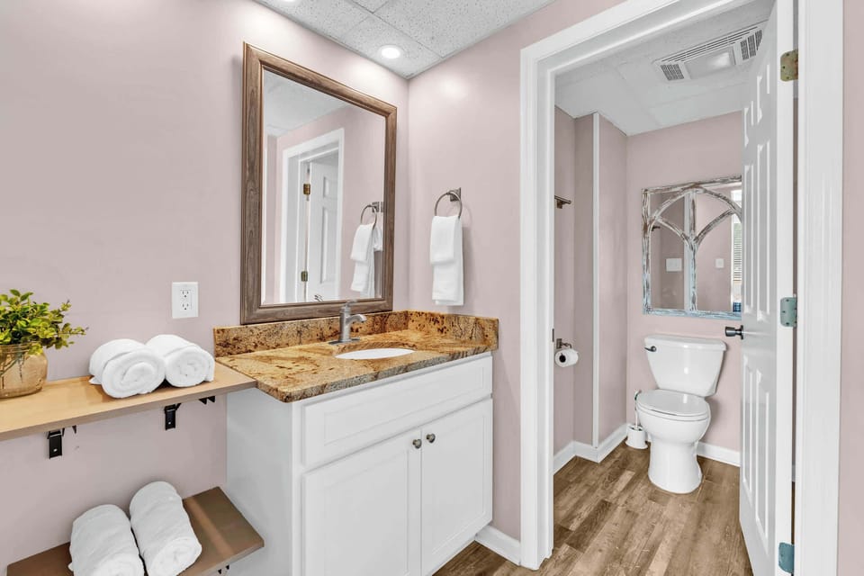 Wash up in this ensuite, featuring a single vanity & shower