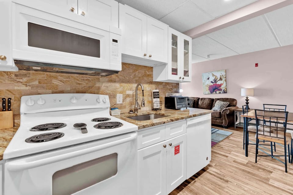 The open, airy kitchen offers ample space & all the comforts of home