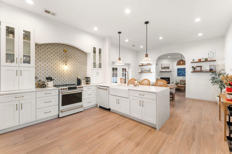The elegant kitchen offers ample space & all the comforts of home