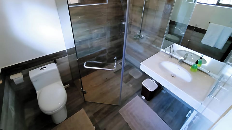 Shower, slippers, towels, soap