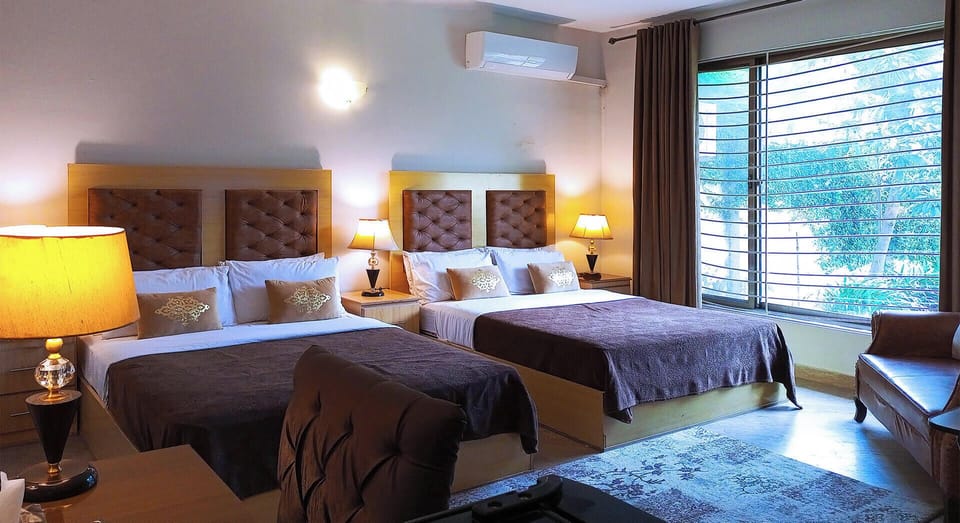 Deluxe Quadruple Room, 2 Queen Beds | Soundproofing, iron/ironing board, free WiFi