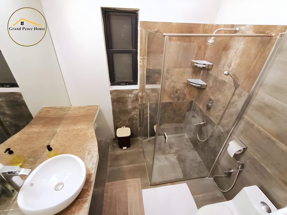 Shower, slippers, towels, soap
