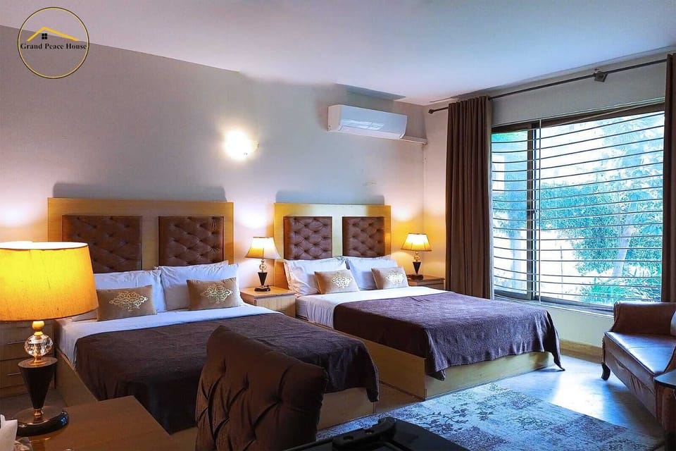 Deluxe Quadruple Room, 2 Queen Beds | Soundproofing, iron/ironing board (on request), WiFi (free)