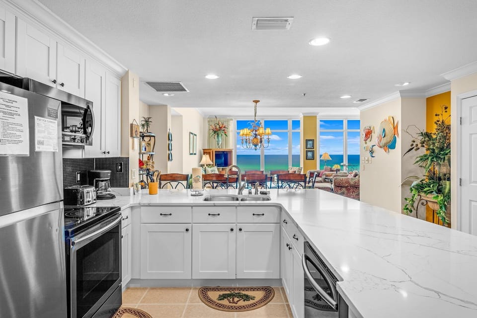 The fully equipped kitchen features quartz countertops, stainless-steel appliances, and everything you need to prepare meals for family and friends.