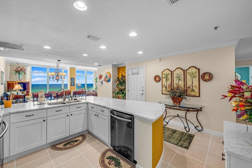 The fully equipped kitchen features quartz countertops, stainless-steel appliances, and everything you need to prepare meals for family and friends.