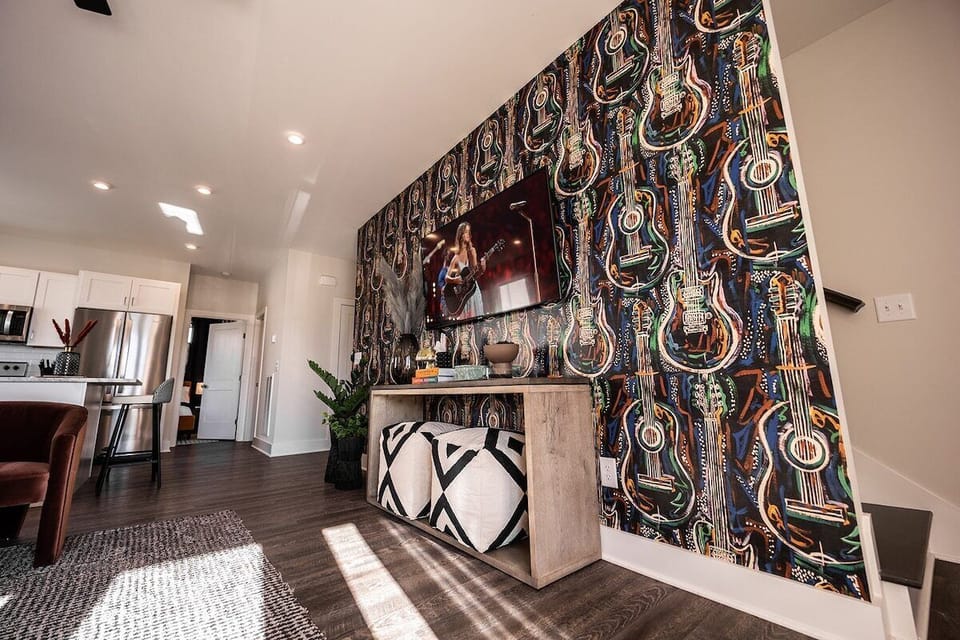 Open concept living area with comfortable seating and TV