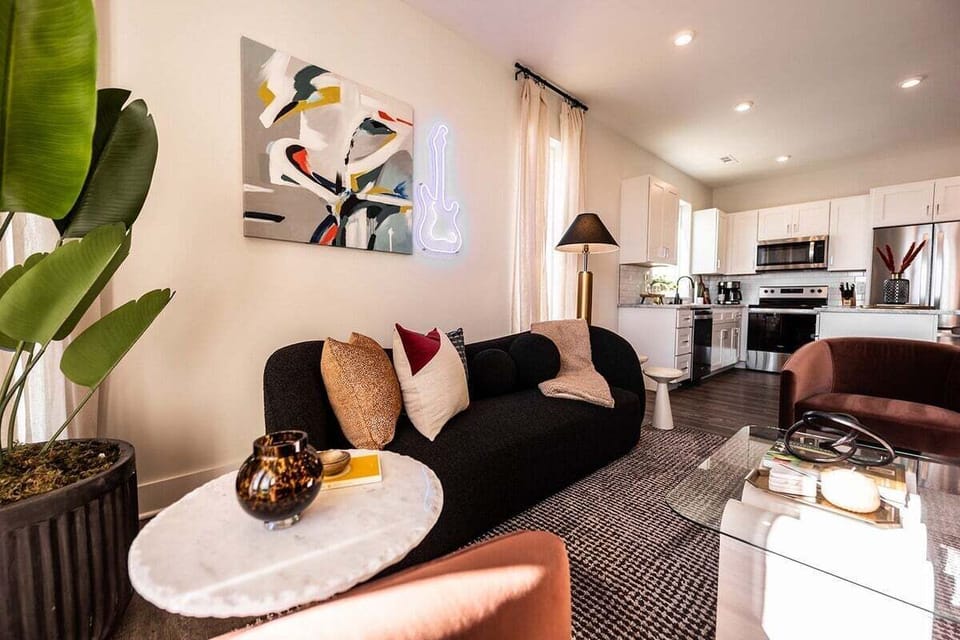 Open concept living area with comfortable seating and TV