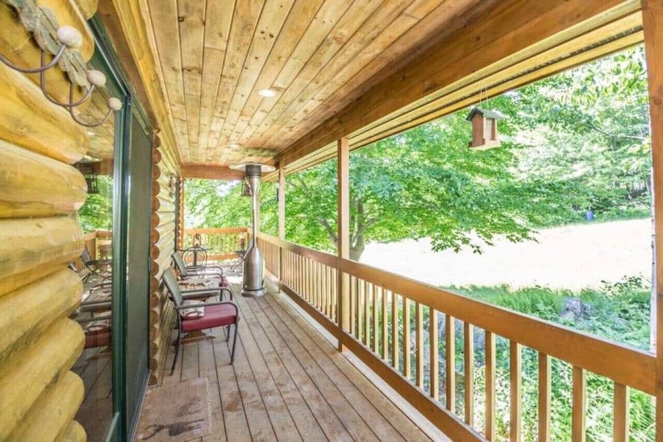 70 ft wrap around covered porch/deck overlooking the trails