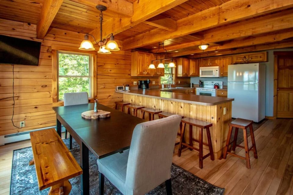 An awesome Kitchen & Dining Rm to congregate with the ball game on the 42` TV
