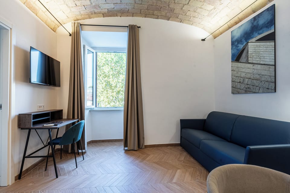 Family Studio, City View | Minibar, in-room safe, desk, laptop workspace