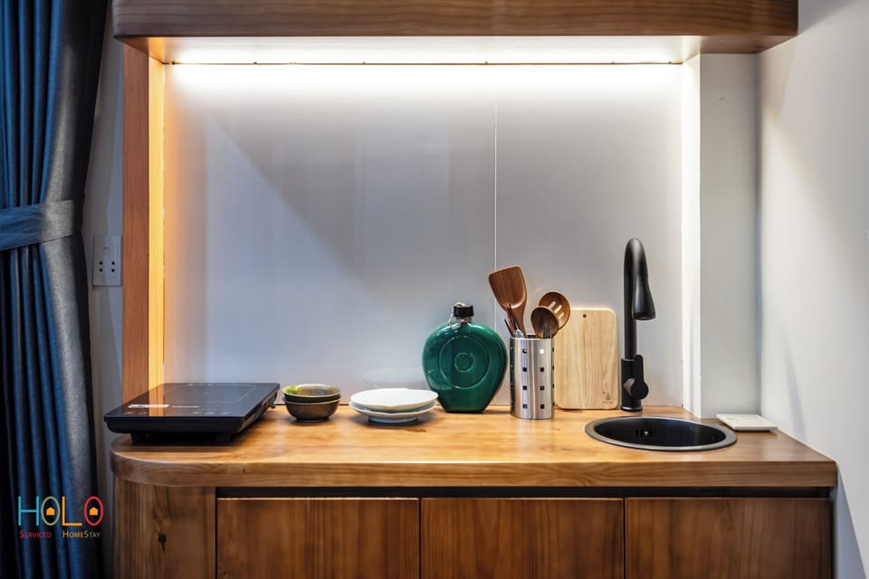 Mini-fridge, electric kettle, cleaning supplies, paper towels