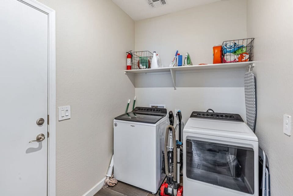Convenient laundry room with a washer and dryer, plus storage space to keep everything organized during your stay.