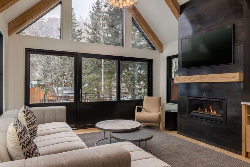 Living Room - Open and bright living space with large sectional and gas fireplace