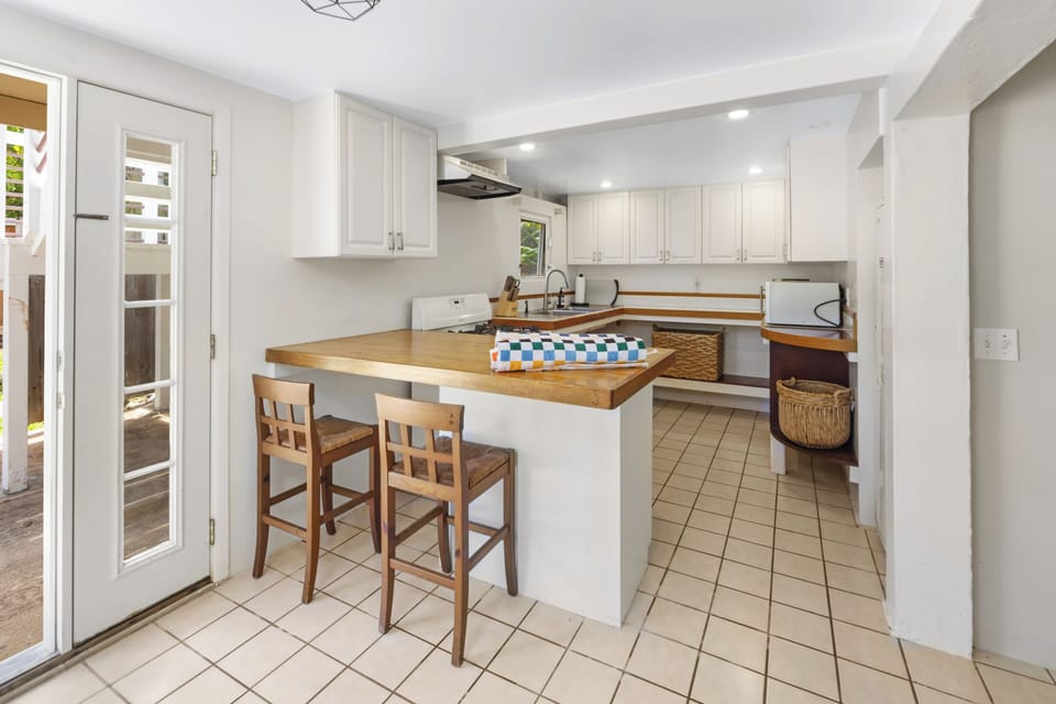 The studio room has a kitchen area featuring ample counter space for a convenient meal prepping.