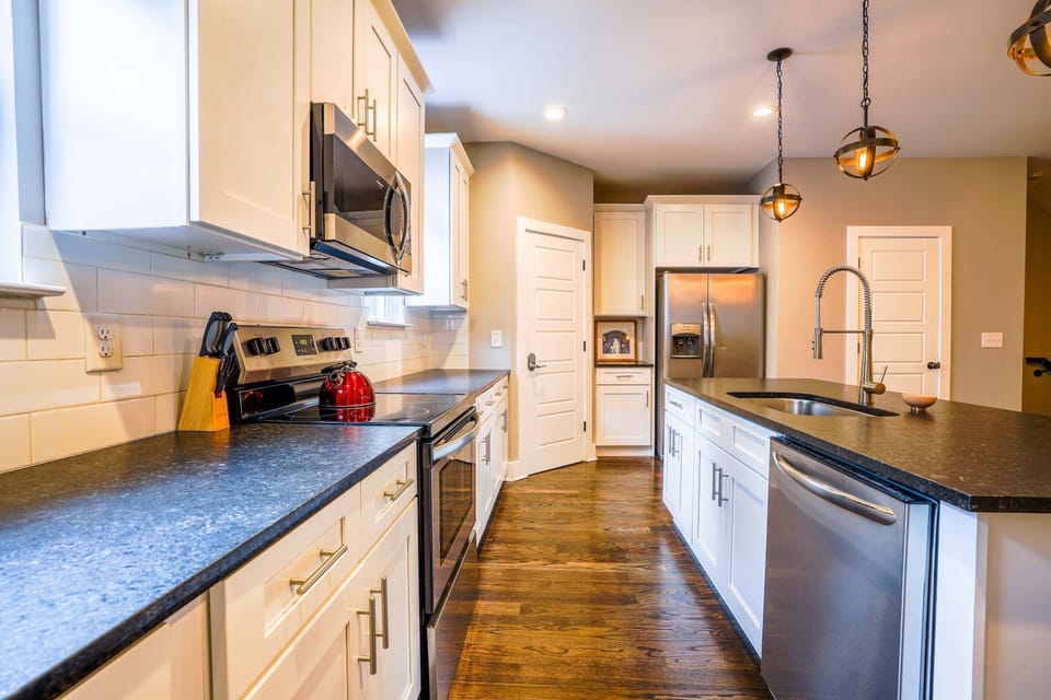 Modern kitchen with toaster, Keurig coffee maker, blender, and more