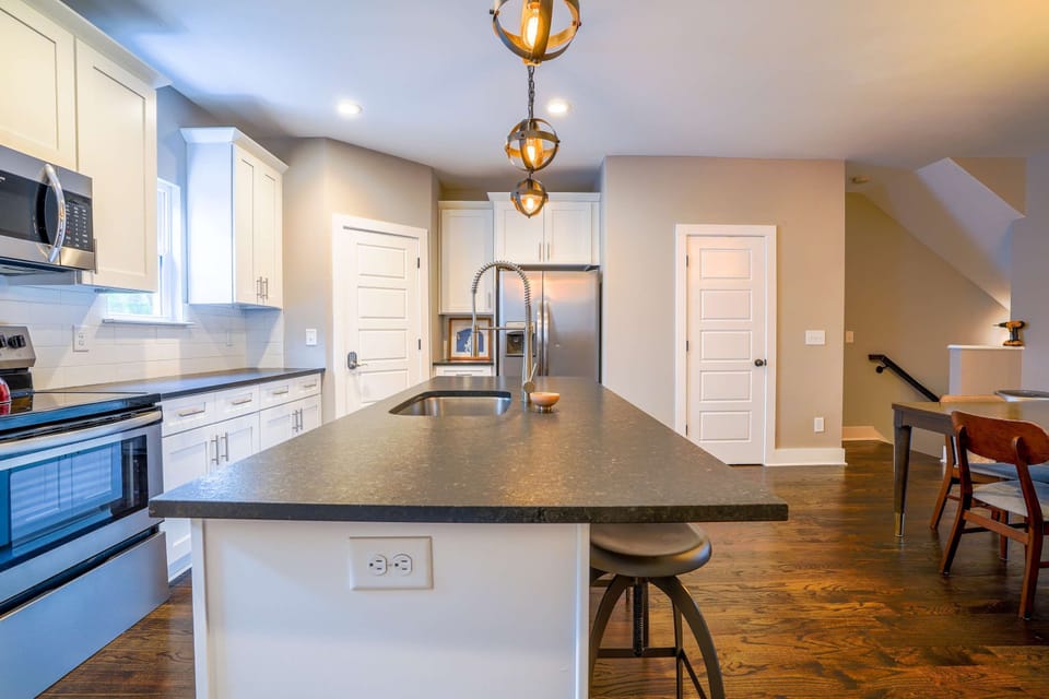 Modern kitchen with toaster, Keurig coffee maker, blender, and more