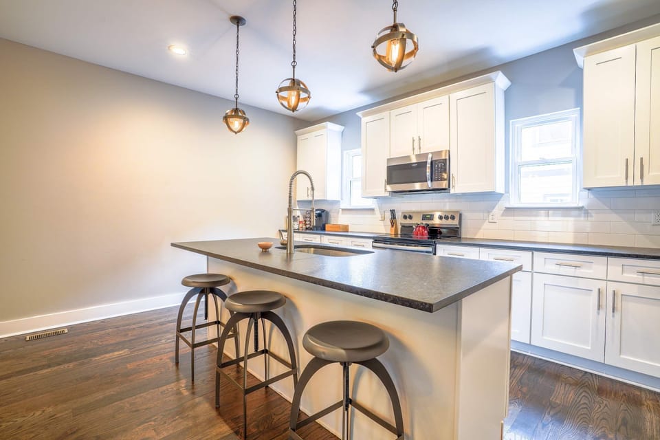 Modern kitchen with toaster, Keurig coffee maker, blender, and more