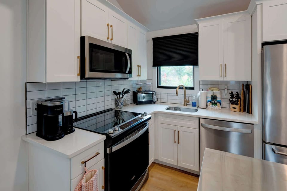The updated kitchen offers ample storage space & all the comforts of home