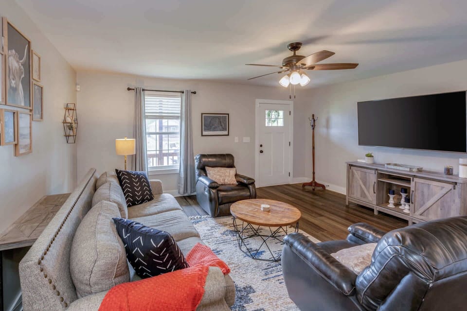 Cozy and spacious living area with TV