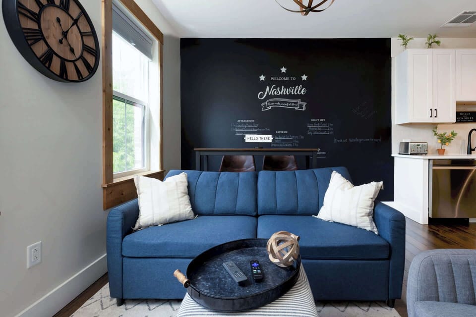The airy living room offers a comfy full sleeper sofa and sining seating for 2